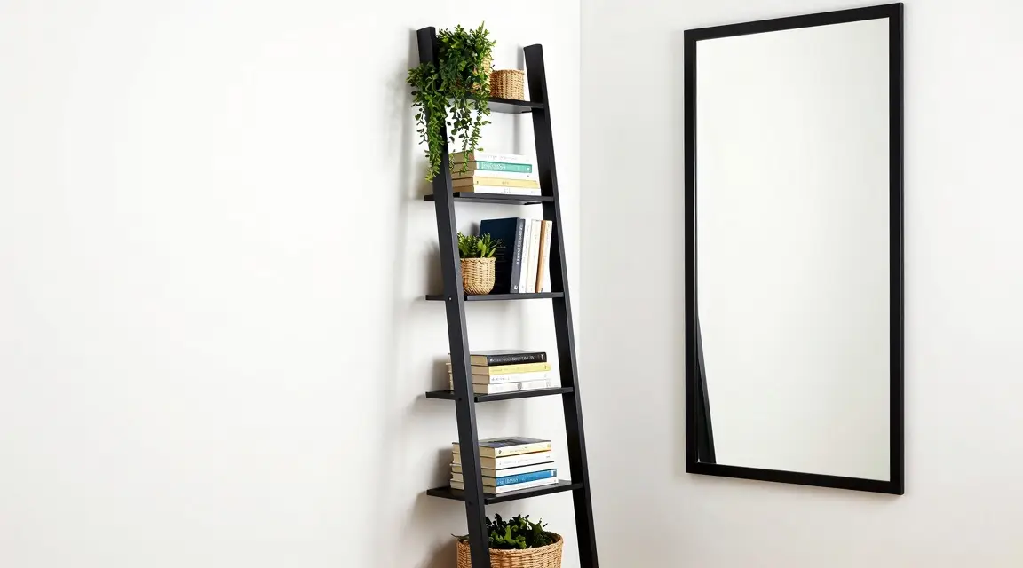 tall slim ladder bookshelf and large floor mirror for vertical space